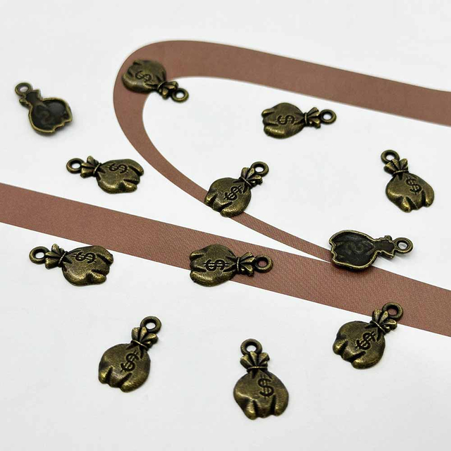 Fiasrel 20/100pcs Antique Bronze Mini US Dollar Sign Charms Vintage Money Bag Charms Beads for DIY Jewelry Making Handmade Craft Supplies