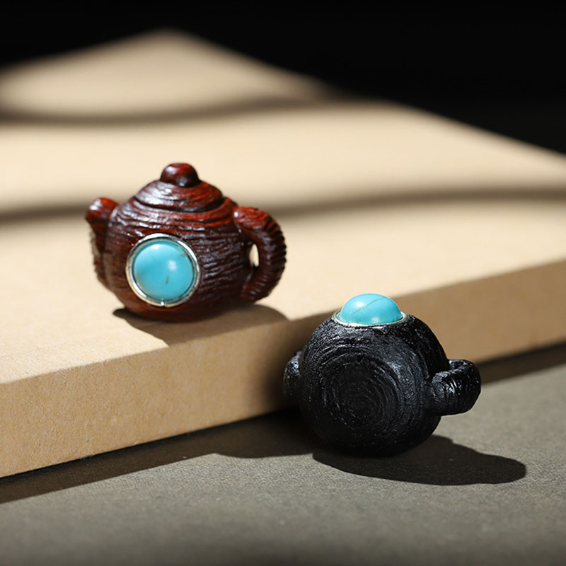 Fiasrel A teapot inlaid with agarwood