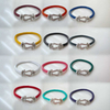 Fiasrel A horseshoe-studded studded woven bracelet